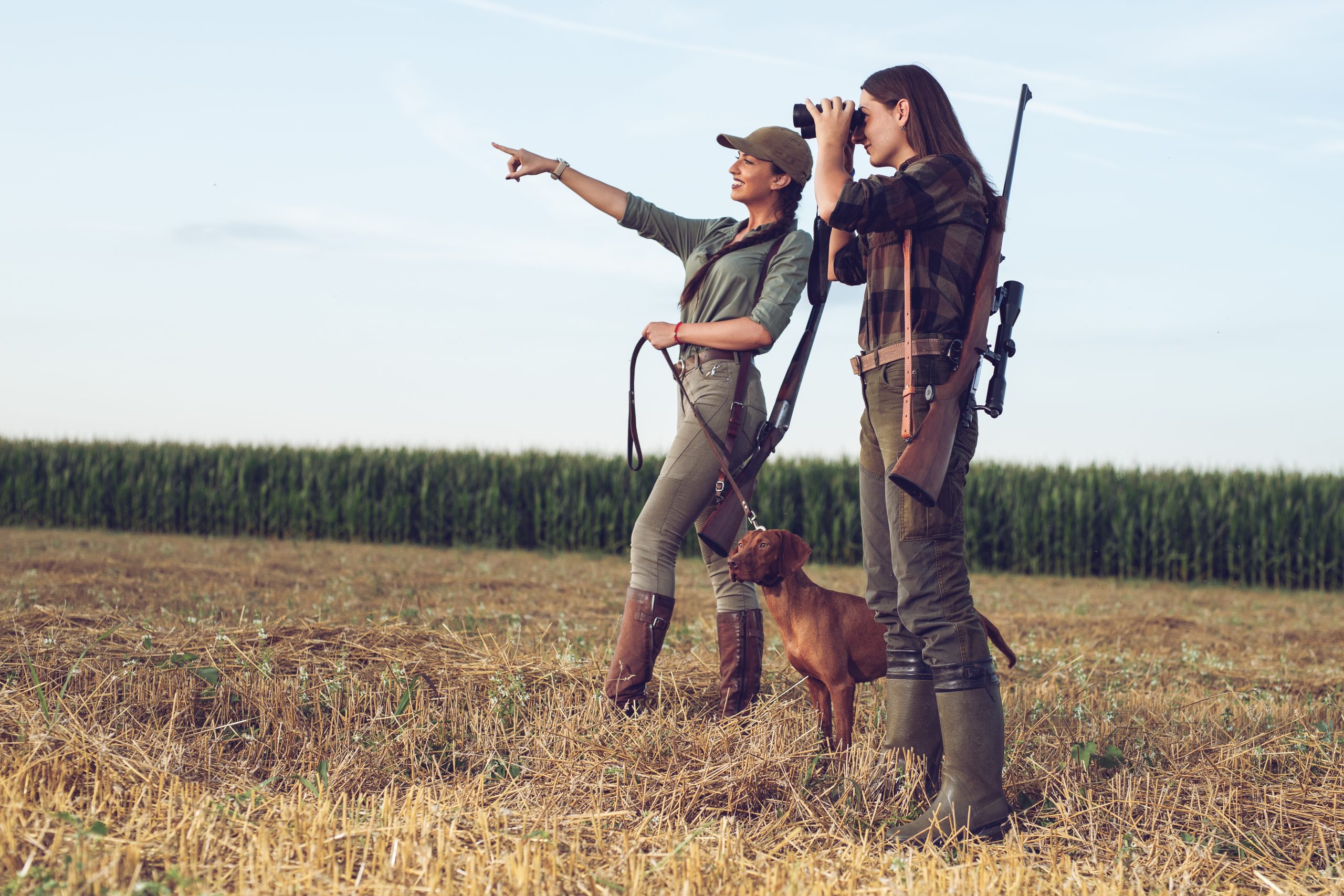 Women hunters with hunting dog